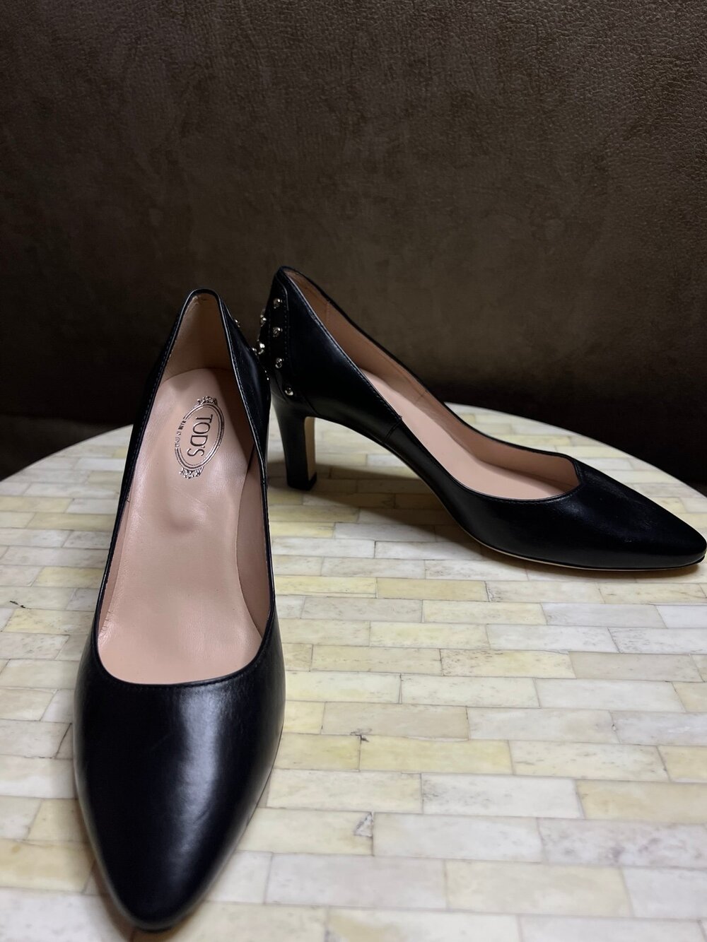Tod's Decollete Gommini Studded Pumps.